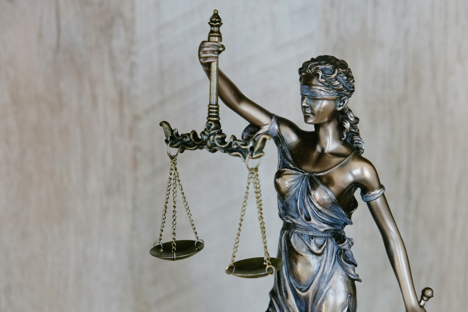 Documents, emails, and evidence organized on a desk for a wrongful termination case